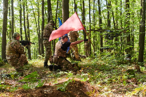 Preview: A disciplined and specialized military unit, donned in camouflage, strategically patrolling and
