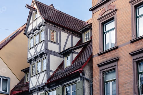 Preview: Beautiful old wooden beam houses with white and orange plaster. Fishermen's Quarter. Fachwerk.