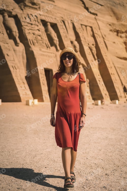 Preview: A young girl in red dress visiting the Egyptian Temple of Nefertari near Abu Simbel