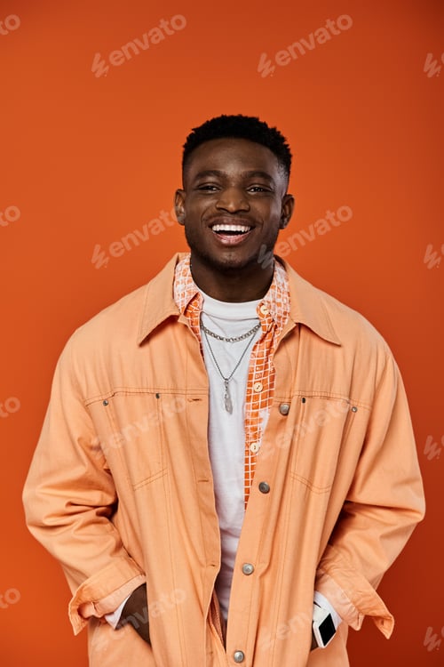 Preview: Stylish African American Man in Vibrant Orange Jacket