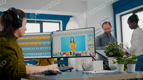 Preview: Retoucher putting on headset working on project drawing with stylus pencil