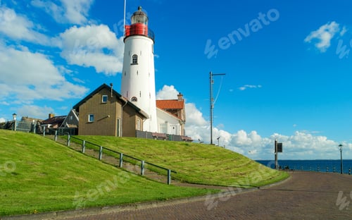 Preview: Urk Flevoland Netherlands sunset at the lighthouse and harbor of Urk Holland