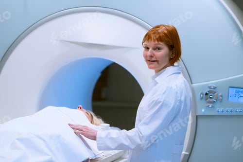 Preview: Female doctor preparing patient for magnetic resonance imaging