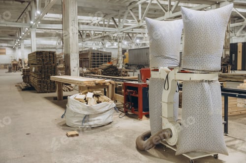 Preview: Wood dust collector machine extracting sawdust in a carpentry workshop