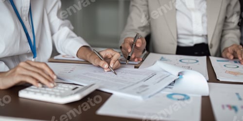 Preview: Business Teamwork Planning and Analysis Meeting with Documents and Charts on Office Desk