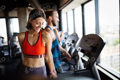 Preview: Close up image of attractive fit woman in gym