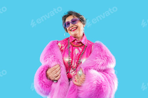 Preview: Happy and funny senior old woman on colorful background