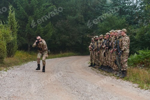 Preview: A major imparts precise military instructions to his elite unit, embodying strategic leadership as