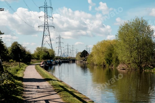 Preview: Canal towpath alongside boats with power lines stretching