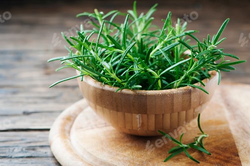 Preview: Fresh green rosemary on the wooden table