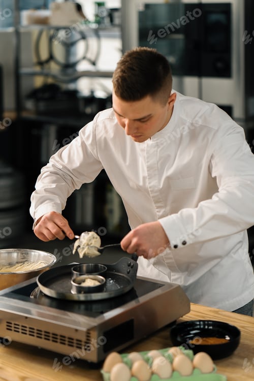 Preview: Professional kitchen chef prepares pancakes kitchen utensils