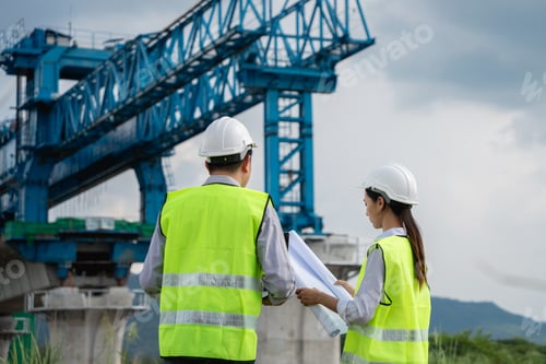 Preview: Two construction workers are standing next to each other