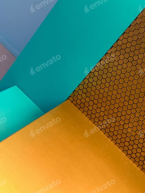 Preview: Vibrant orange, turquoise, and blue painted wall with honeycomb pattern