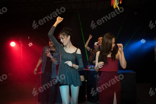 Preview: Party young people group dancing in night club