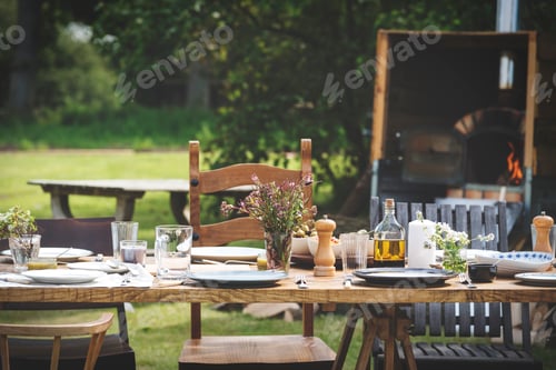 Rustic Table Setting with Flowers and Olives