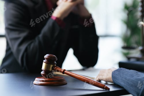 Preview: Lawyer working with client discussing contract papers with brass scale about legal legislation.