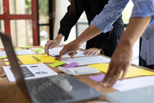 Preview: Meeting colleagues is discussing marketing strategy analysis and planning to achieve business goals.