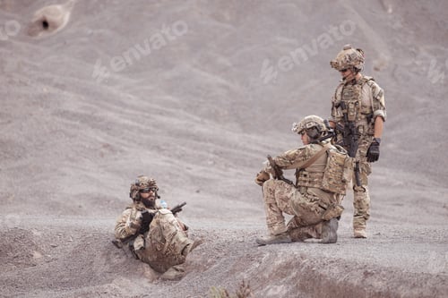Preview: Soldiers in camouflage military uniforms carrying weapons Reconnaissance missions in rugged mountain
