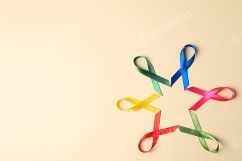 Preview: Flat lay composition with awareness ribbons on color background, space for text.