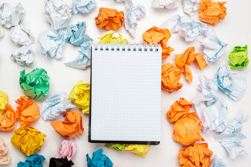 Preview: Office workspace with an empty notebook, crumpled paper