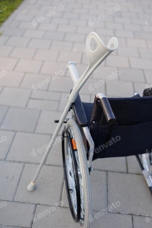Preview: Wheelchairs and Crutches Resting Outdoors