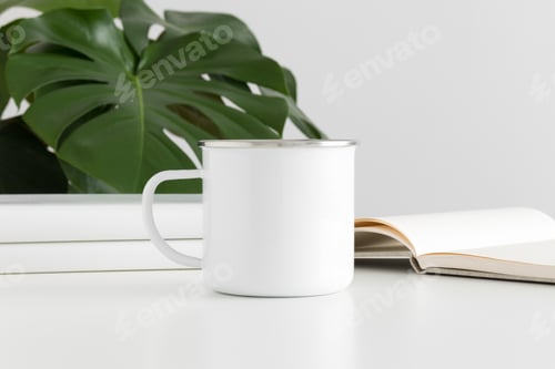 Preview: Enamel mug mockup with workspace accessories and a monstera plant.