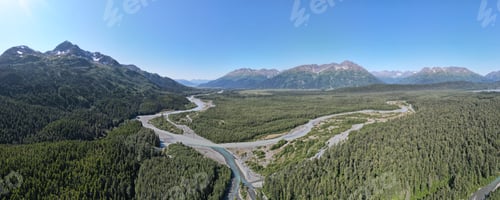 Preview: Panorama view of beautiful mountains near a forest