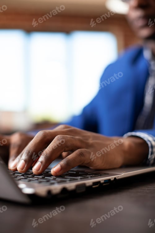 Preview: Hand of person on laptop keyboard
