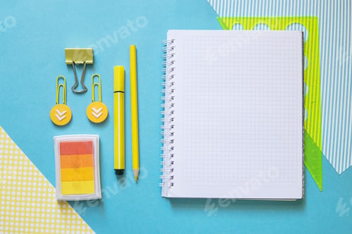 Preview: School supplies. Yellow and blue colors. Empty notebook. Flat lay composition. Space for text.