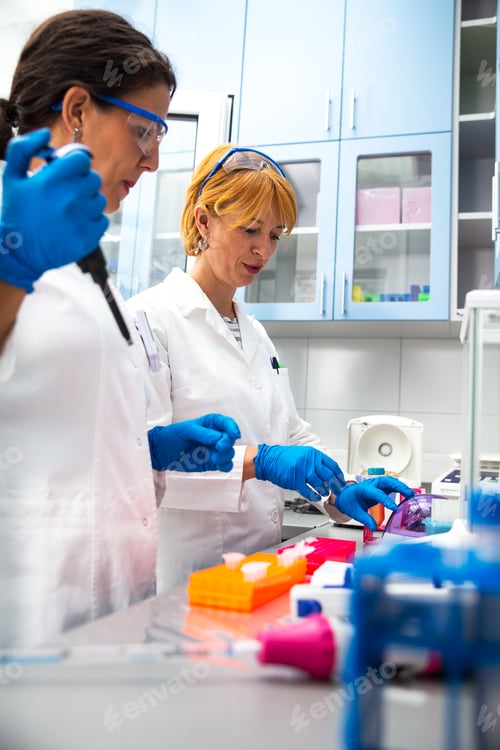 Preview: Photo of three real female scientists researching in laboratory.