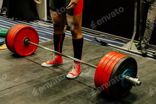 Preview: legs powerlifter in black knee socks in front barbell at deadlift competition