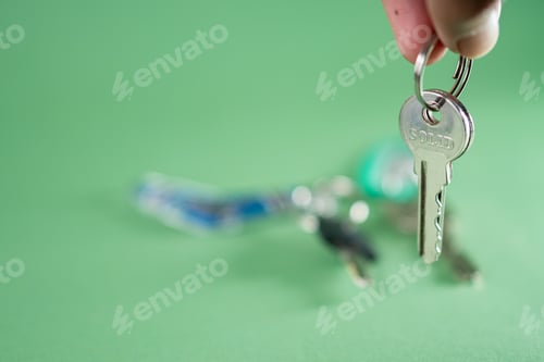 Preview: Close-Up of a Key on a Green Background
