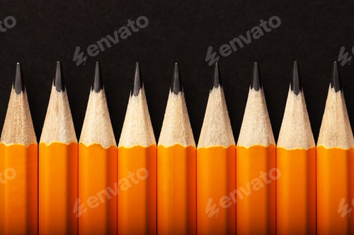 Preview: Abstract background of orange pencils lying in a row