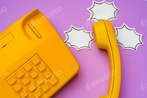 Preview: Yellow landline phone with speech bubble on purple background
