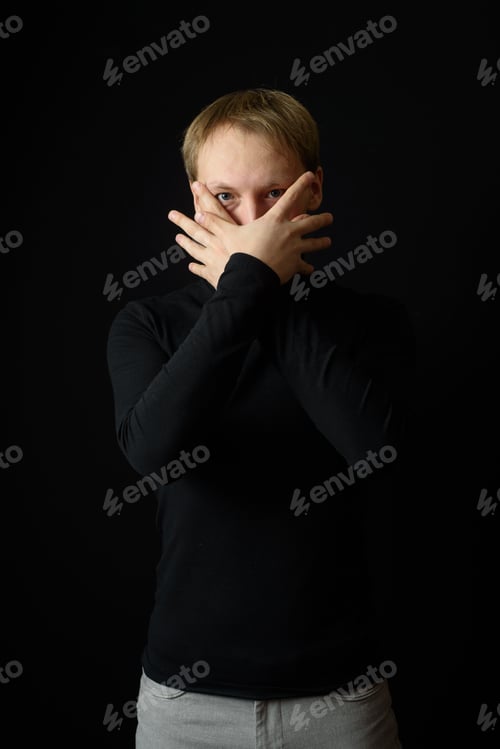 Preview: Close up portrait of a young man in a white shirt and black tie.