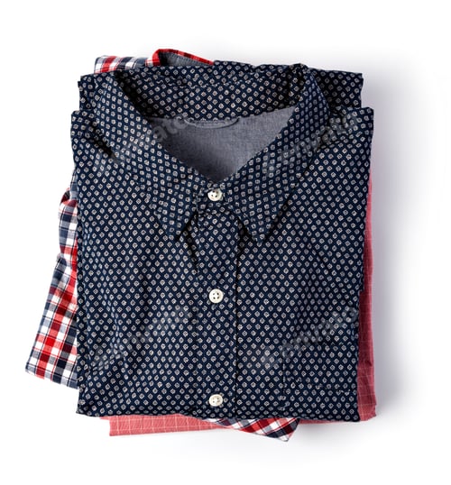 Preview: Neatly Folded Shirts on a White Background