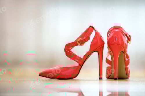 Preview: Elegant Red High Heels on a Wooden Floor