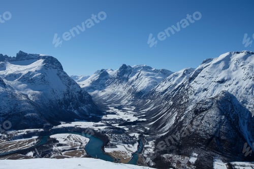 Preview: Breathtaking view of a fjord between the snow-covered mountains in Andalsnes, Norway