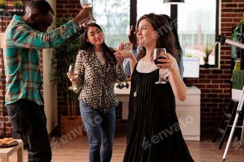Preview: Caucasian girl happily dancing accompanied of african american man