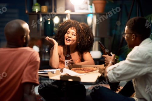 Preview: Shot of a group of businesspeople having beers at the office while working late