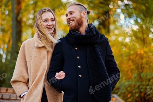 Preview: Bearded male hugs the cute blonde female on the date.