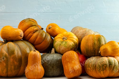 Preview: Assortment of small pumpkins on wooden background