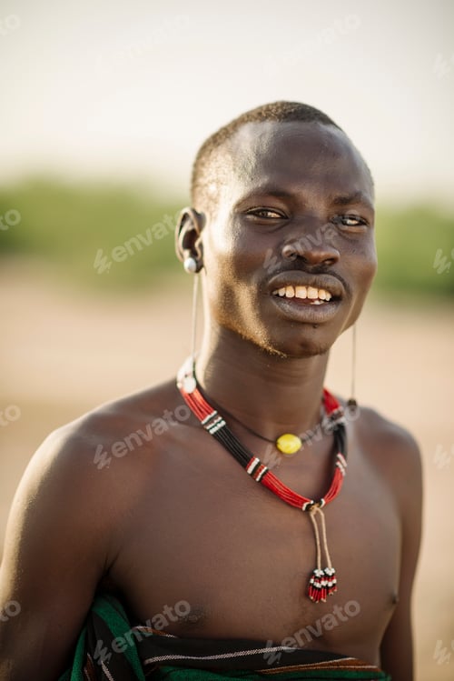 Preview: Smiling man basking in golden sunlight