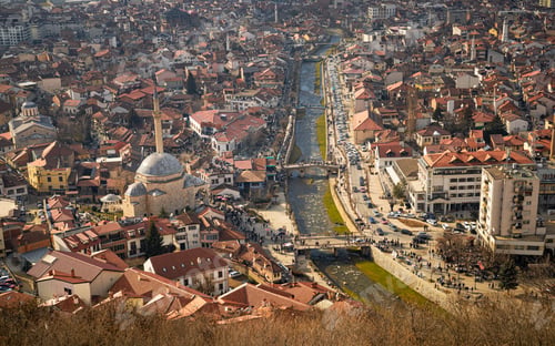 Preview: Aerial view of the cityscape of Prizren, Kosovo with mosques on a sunny day