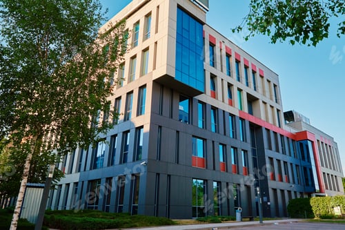 Preview: Modern office building with green trees