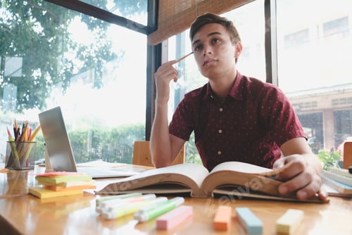 Preview: Man reading a book.