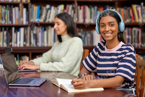 Preview: A Trained Librarian is a Powerful Search Engine. Shot of two students studying in a library.
