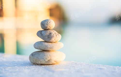 Preview: Rock stone stack balance pyramid on water, Symbol of Zen meditation and health well blurred space
