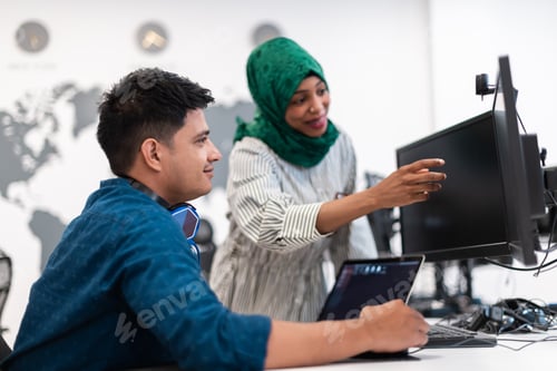 Preview: Multiethnic startup business team Arabian woman wearing a hijab on meeting in modern open plan