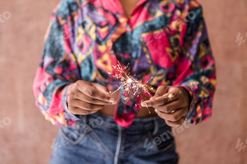 Preview: Crop ethnic female with sparklers